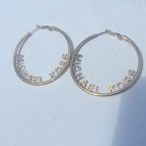 Michael Kors Gold Hoops with Micheal Kors Letters plated on the inside of Hoops
